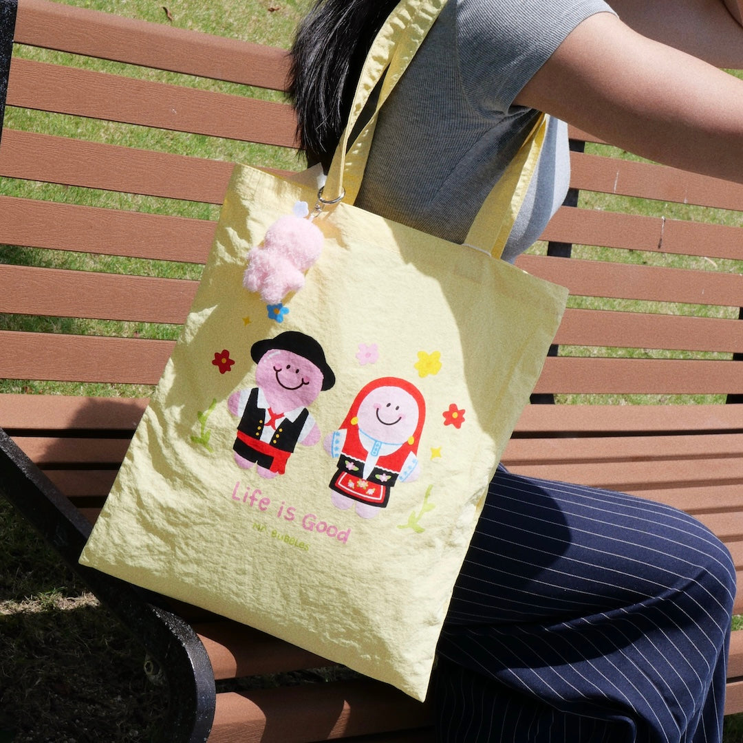 Mr.Bubbles and Petals in Portuguese costumes on yellow Macau-inspired tote bag
